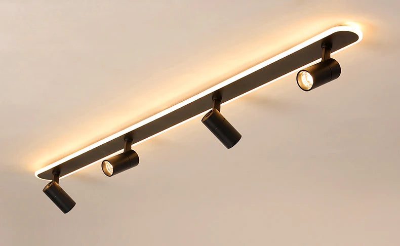 Système d’éclairage sur rail avec spots LED directionnels pour un éclairage ciblé.