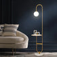 Lampadaire décoratif avec pied en marbre et abat-jour en verre pour un éclairage doux.